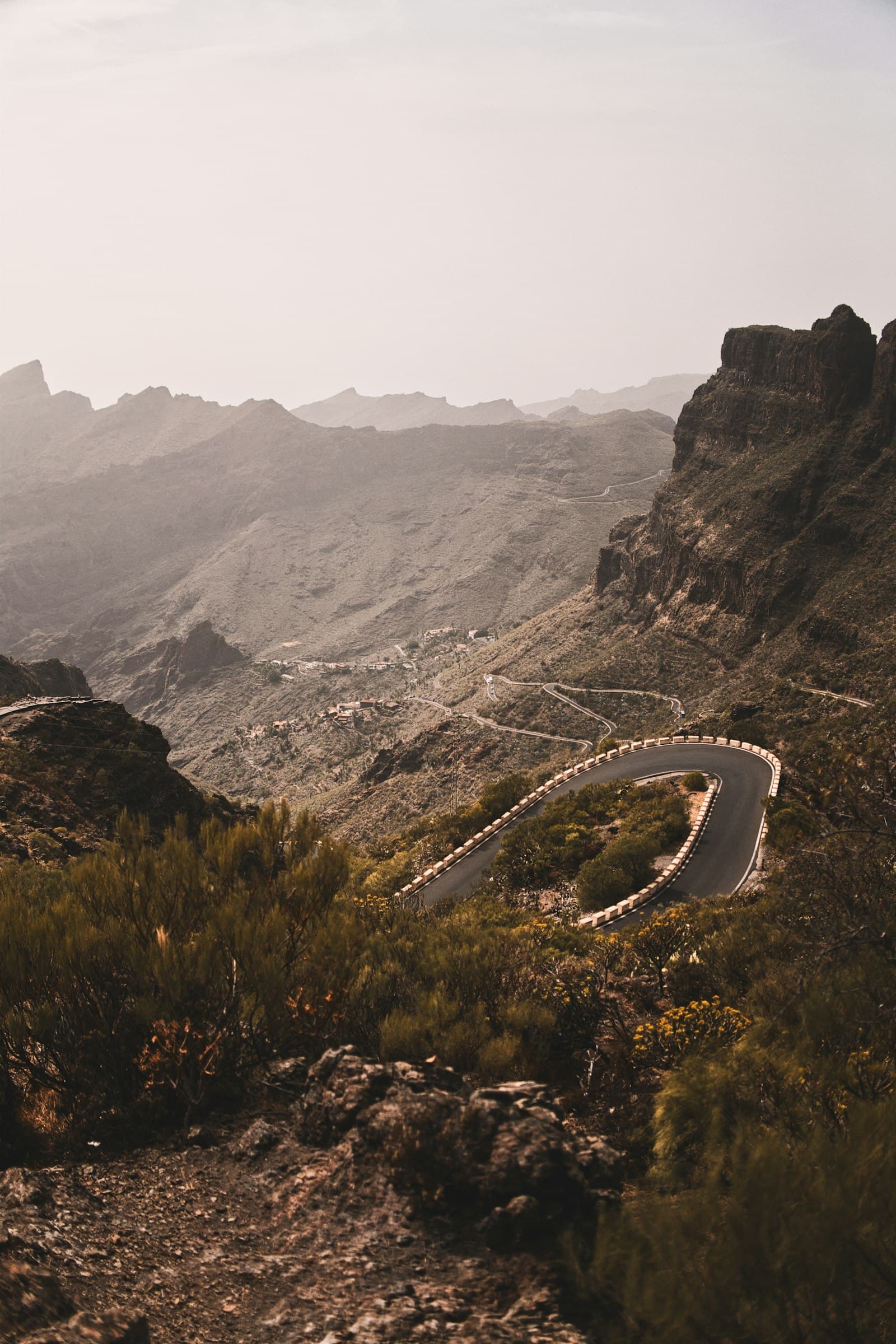 Mountain road curving through a canyon.